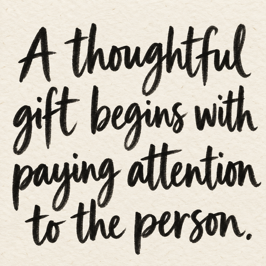 Black brush lettering on ivory handmade paper: “A thoughtful gift begins with paying attention to the person.”