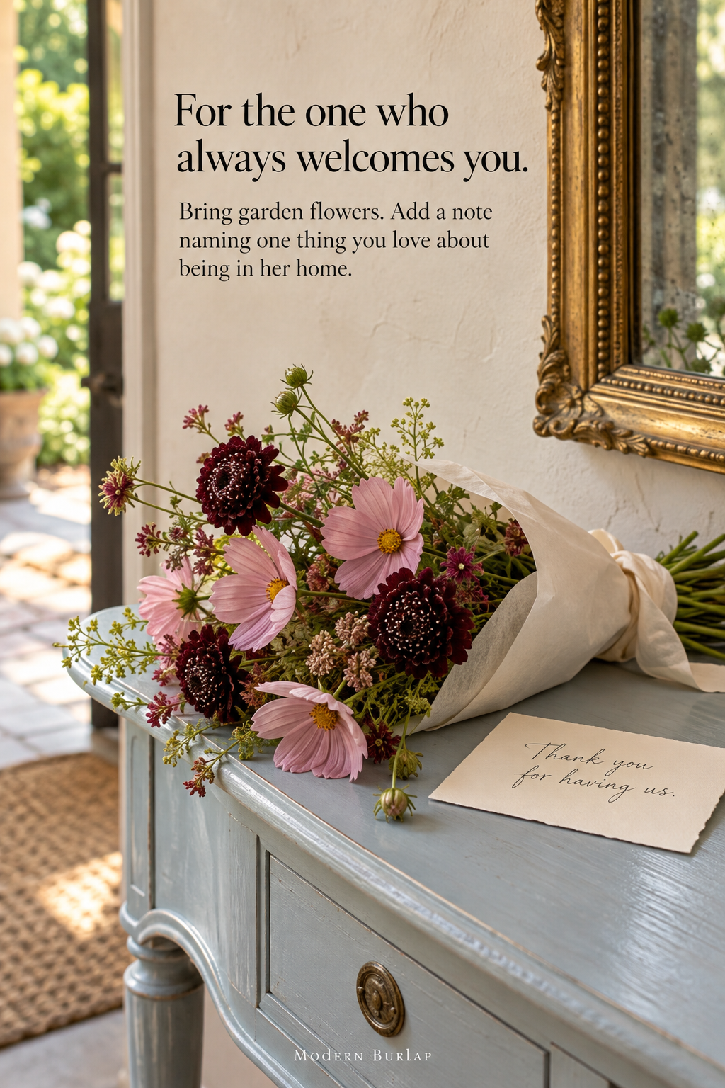 Garden flowers and a handwritten thank-you on a pale blue console. Headline: For the one who always welcomes you.