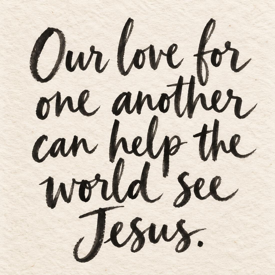 Black brush lettering on ivory handmade paper: “Our love for one another can help the world see Jesus.”