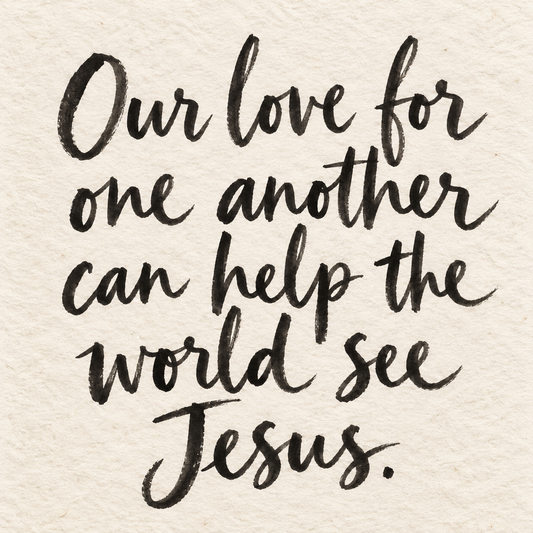Black brush lettering on ivory handmade paper: “Our love for one another can help the world see Jesus.”