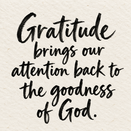 Black brush lettering on ivory handmade paper: “Gratitude brings our attention back to the goodness of God.”