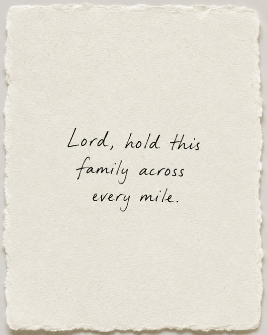 Handwritten prayer Lord, hold this family across every mile on ivory handmade paper