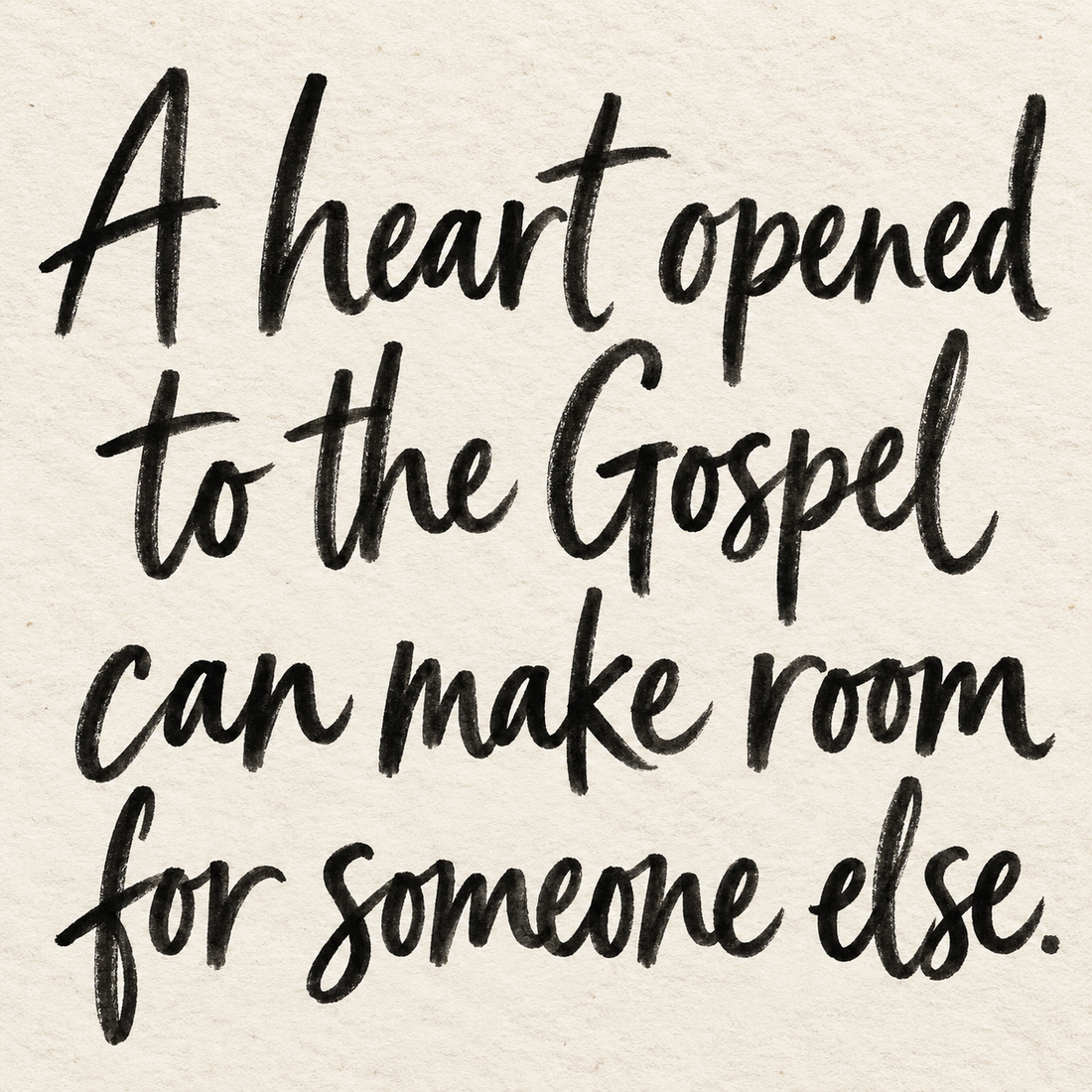 Black brush lettering on ivory handmade paper: “A heart opened to the Gospel can make room for someone else.”