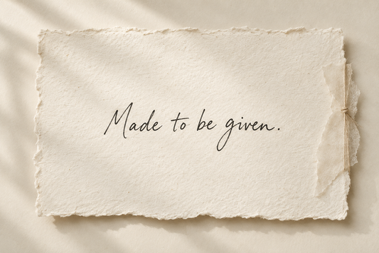 Handwritten artwork on ivory handmade paper reading Made to be given.