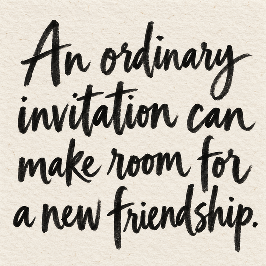 Black brush lettering on ivory handmade paper: “An ordinary invitation can make room for a new friendship.”