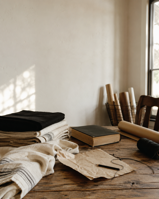 Bible, natural textiles, kraft paper, and black thread for Scripture for a New Baby