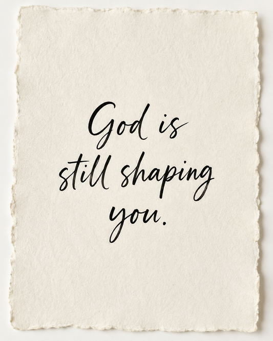 Handmade devotional artwork reading God is still shaping you