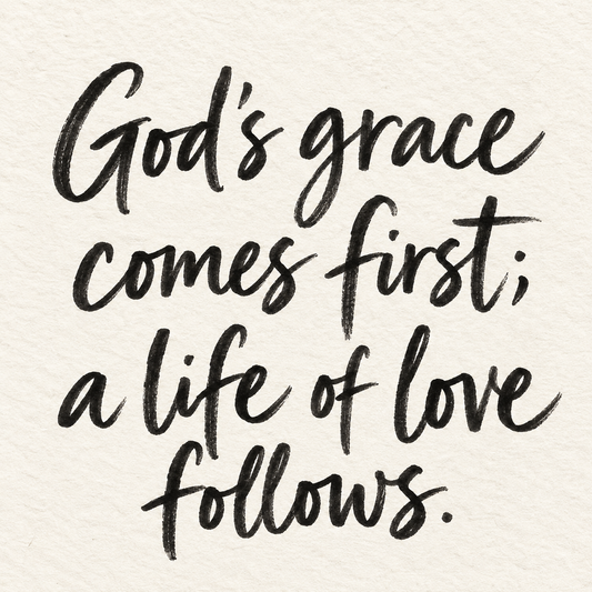 Black brush lettering on ivory handmade paper: “God's grace comes first; a life of love follows.”