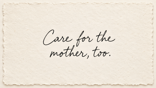 Black handwriting on ivory handmade paper reading "Care for the mother, too."