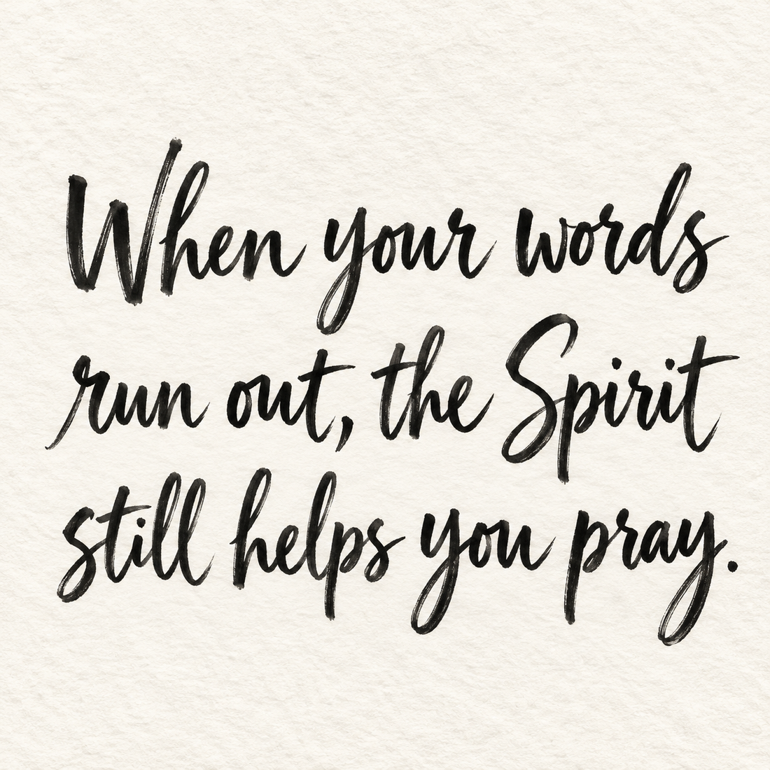 Black brush lettering on ivory handmade paper: “When your words run out, the Spirit still helps you pray.”