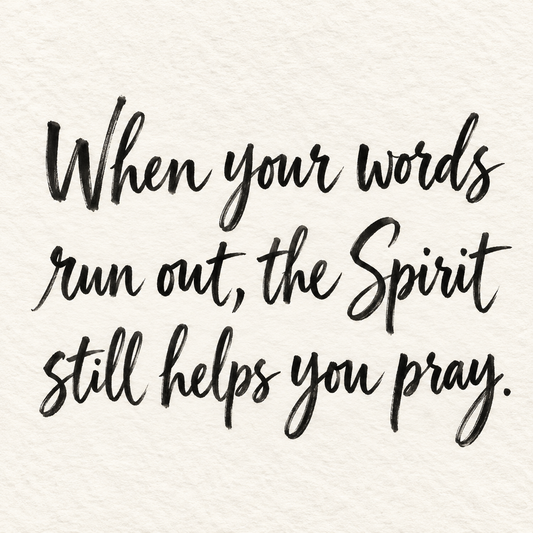 Black brush lettering on ivory handmade paper: “When your words run out, the Spirit still helps you pray.”