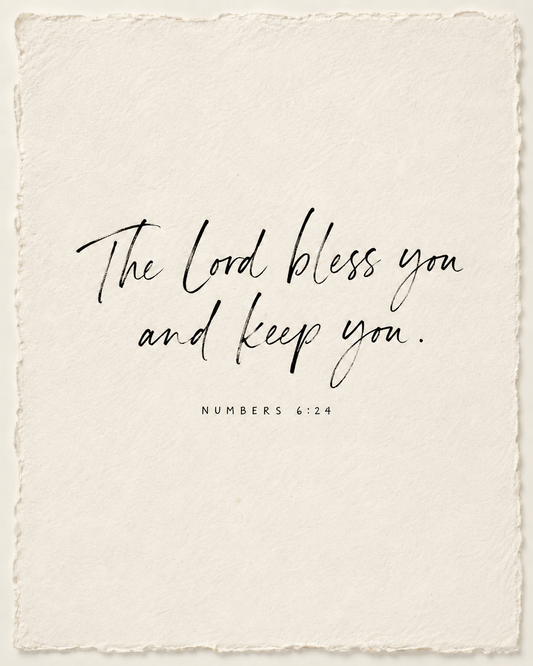 The Lord bless you and keep you. Numbers 6:24, handwritten in black ink on ivory paper.