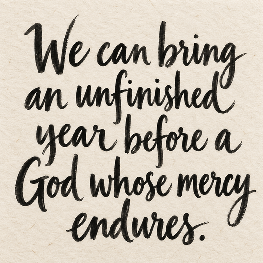 Black brush lettering on ivory handmade paper: “We can bring an unfinished year before a God whose mercy endures.”