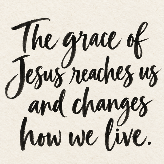 Black brush lettering on ivory handmade paper: “The grace of Jesus reaches us and changes how we live.”