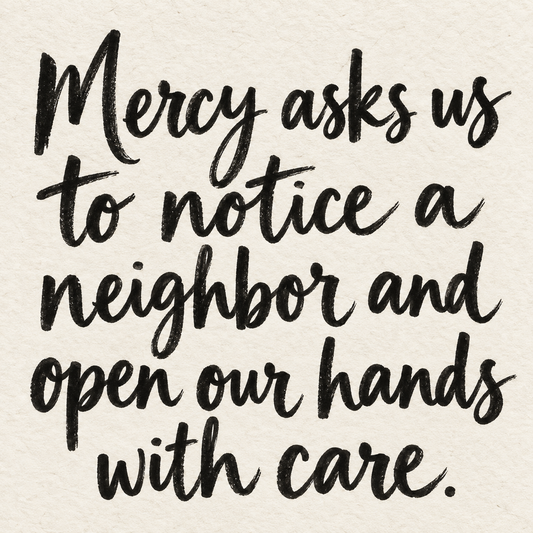 Black brush lettering on ivory handmade paper: “Mercy asks us to notice a neighbor and open our hands with care.”