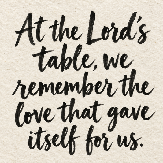 Black brush lettering on ivory handmade paper: “At the Lord’s table, we remember the love that gave itself for us.”