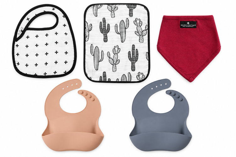 Bibs and burp cloths on white: Swiss Cross muslin bib, Cactus burp cloth, Maroon bibdana, and Peach and Ocean silicone bibs. Items sold separately.
