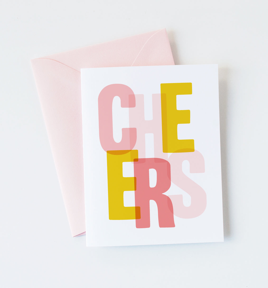 Cheers greeting card by Graphic Anthology, with pink and yellow lettering and blush envelope.