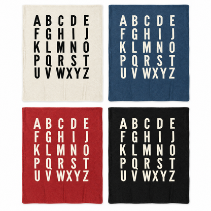 ABC blanket in Natural, Slate Blue, Rust Red and Black, shown at matching scale. Each sold separately; availability varies by size.