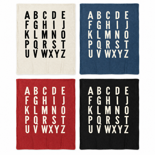 ABC blanket in Natural, Slate Blue, Rust Red and Black, shown at matching scale. Each sold separately; availability varies by size.