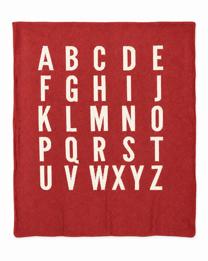 ABC blanket in Rust Red, full studio view on white.