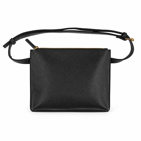 Black vinyl belt bag with narrow adjustable strap and gold zipper on white