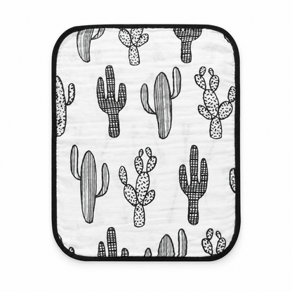 Cactus side of one reversible Cactus + Arrows organic muslin burp cloth with black binding. Studio flat lay on white; one reversible cloth included.