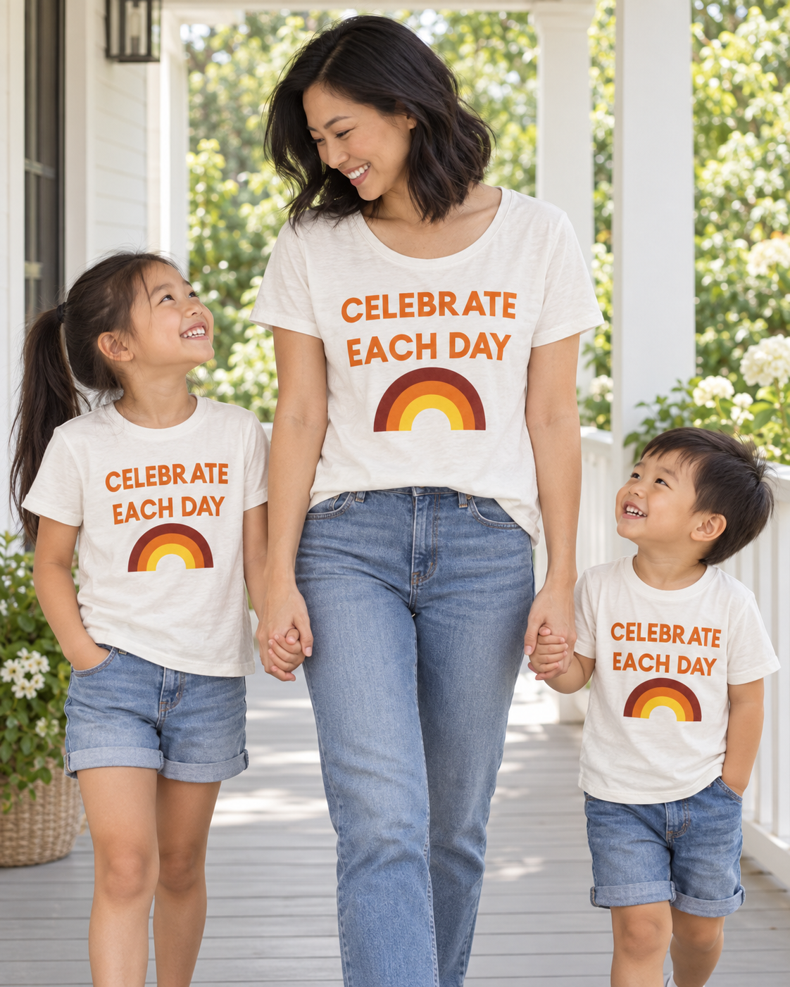 AI-styled mother and two children wearing coordinating Celebrate Each Day tees; each tee sold separately