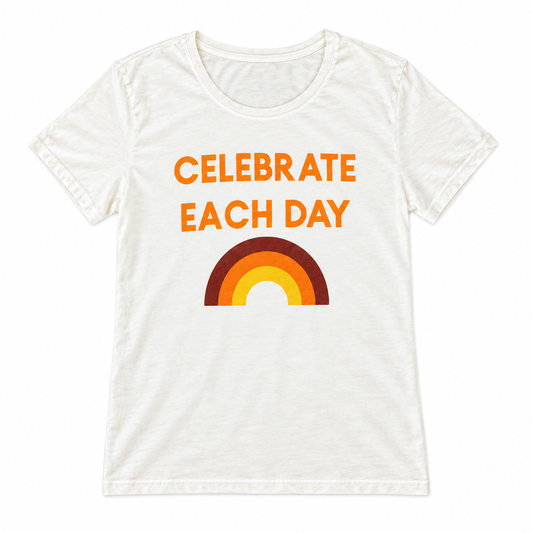 Celebrate Each Day organic women's tee, full front view with orange lettering and rainbow on ivory cotton