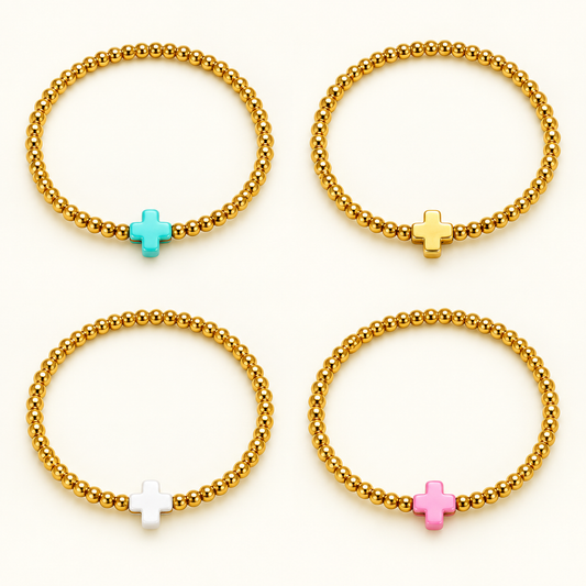 So Very Blessed cross bracelets in Blue, Gold, White and Pink. Sold separately.