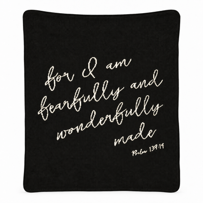 Fearfully and Wonderfully Made blanket in Black, full studio view on white.