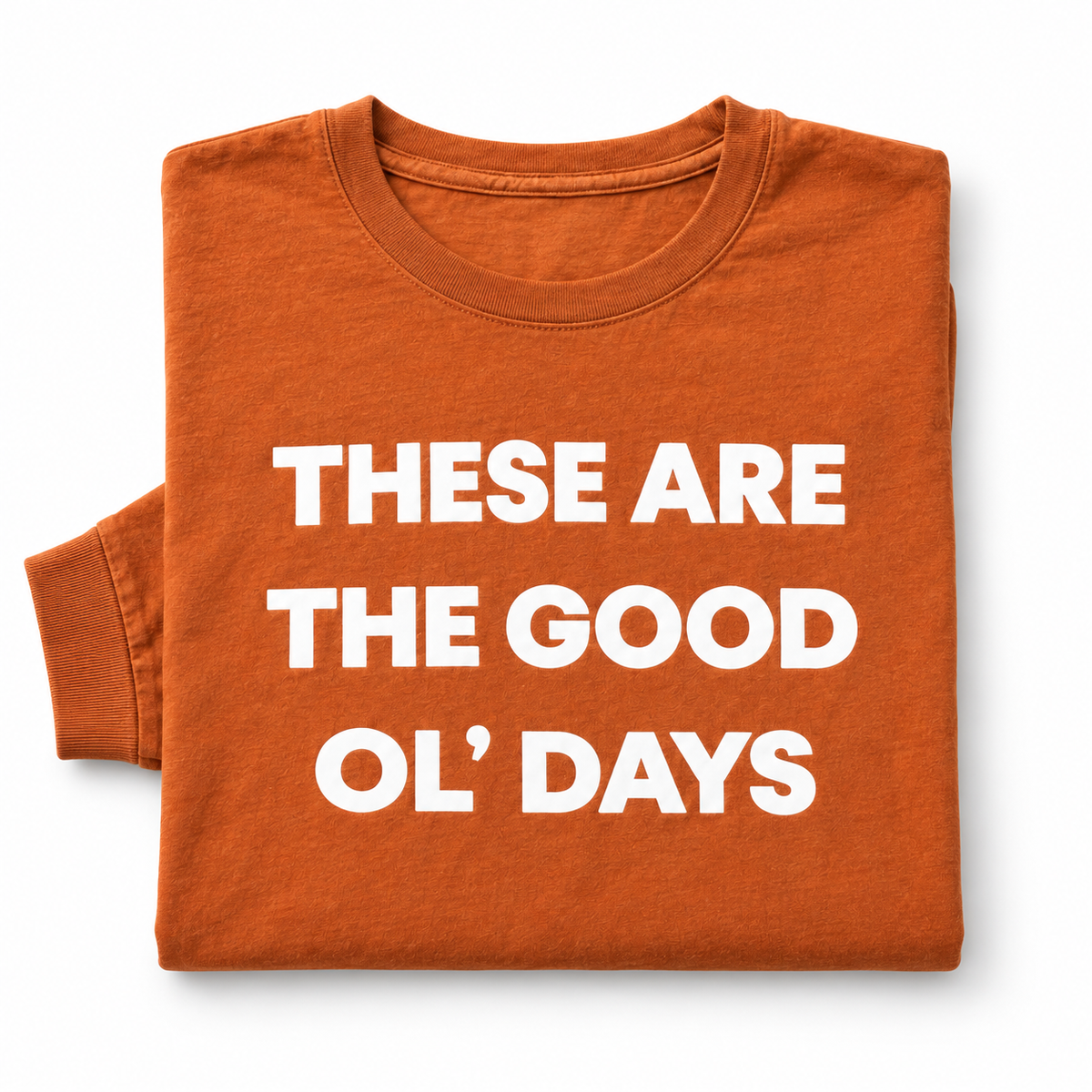 These Are the Good Ol’ Days Sunburn long sleeve tee folded on white, showing the crew neckline, white lettering and sleeve cuff.