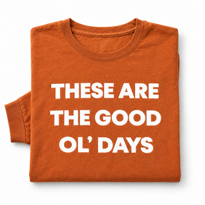 These Are the Good Ol’ Days Sunburn long sleeve tee folded on white, showing the crew neckline, white lettering and sleeve cuff.