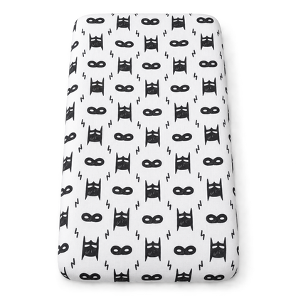Hero Struck organic changing pad cover shown fitted on a pad against white.