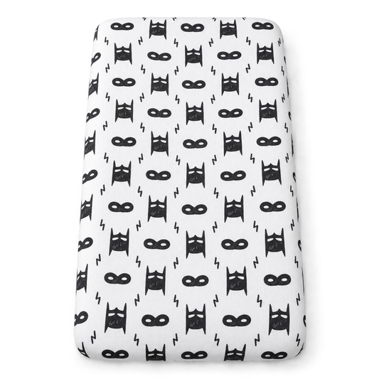 Hero Struck organic changing pad cover shown fitted on a pad against white.