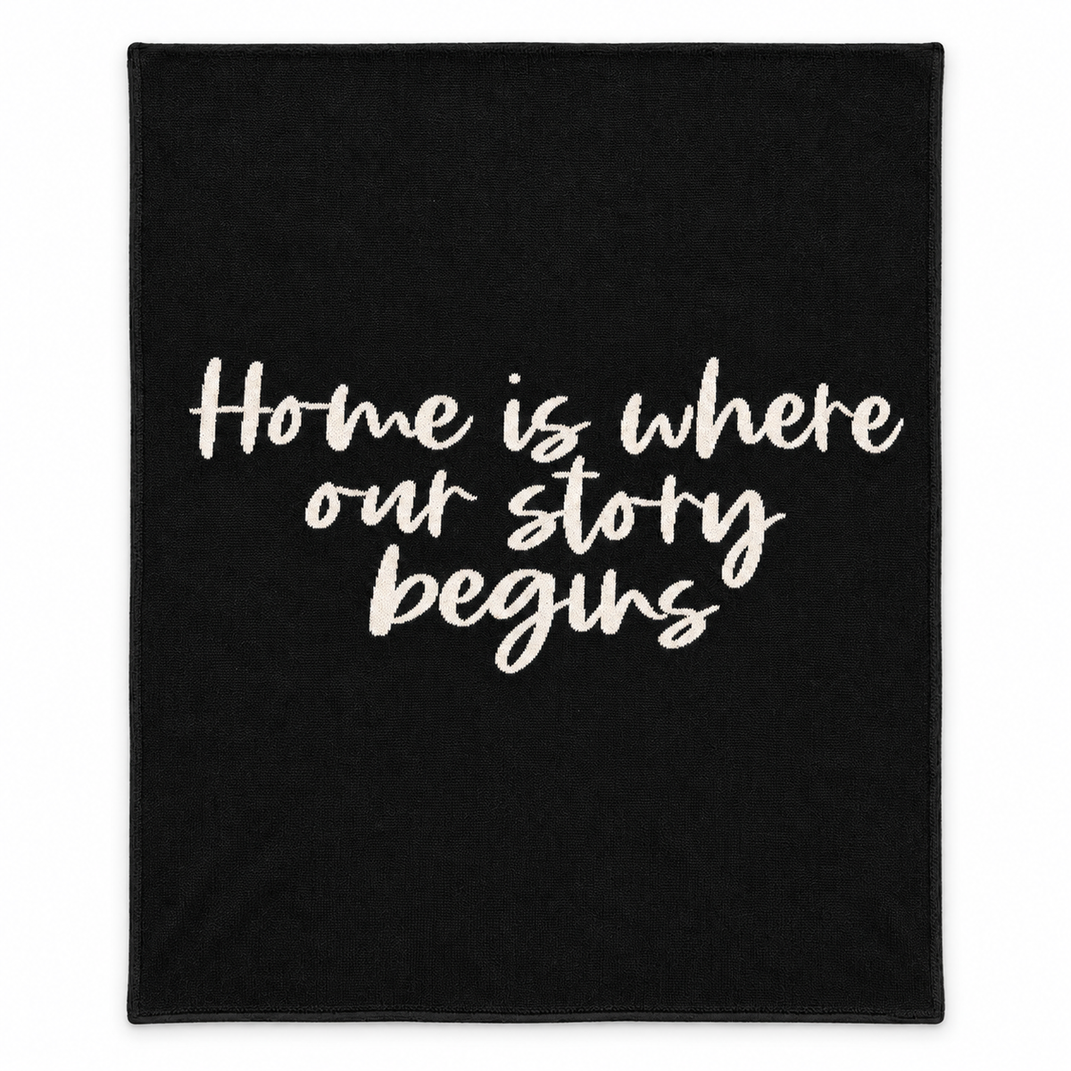 Home Is Where Our Story Begins knit throw in Black, full studio view.