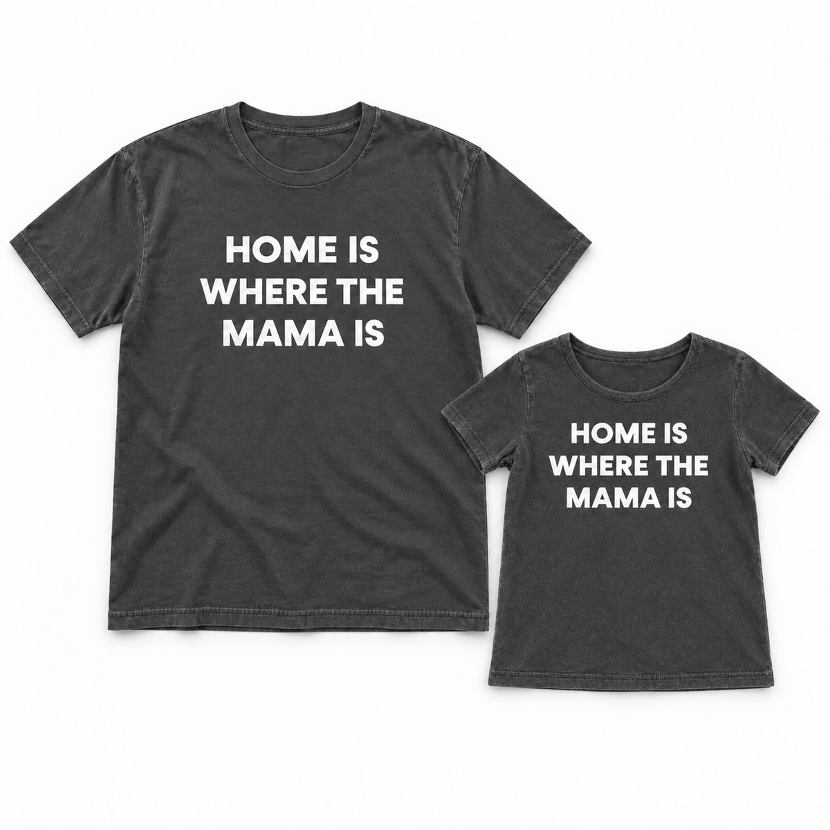 Home Is Where the Mama Is adult and kids' tees together in a studio flat lay; each tee sold separately.
