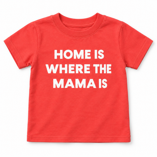 Living Coral Home Is Where the Mama Is kids crewneck tee, full front studio flat lay — AI-rendered from original product photographs