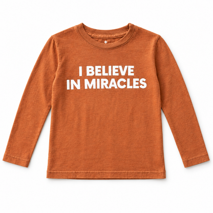 Sunburn I Believe in Miracles kids long-sleeve tee, front studio flat lay.