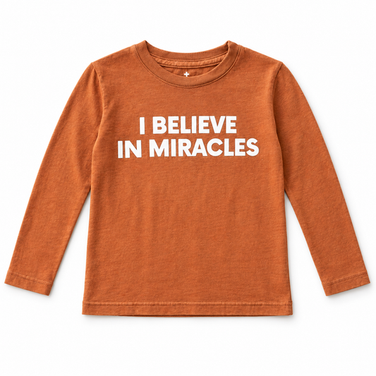 Sunburn I Believe in Miracles kids long-sleeve tee, front studio flat lay.