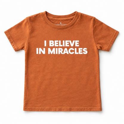 Sunburn I Believe in Miracles kids short-sleeve tee, front studio flat lay.