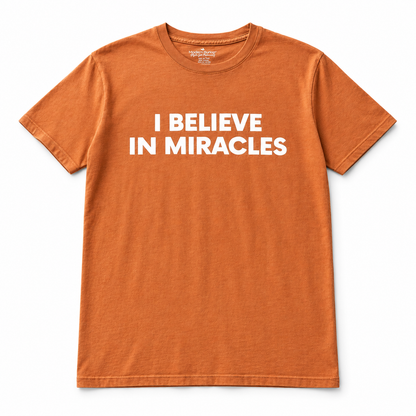 I Believe in Miracles Sunburn unisex tee, full front studio view on white