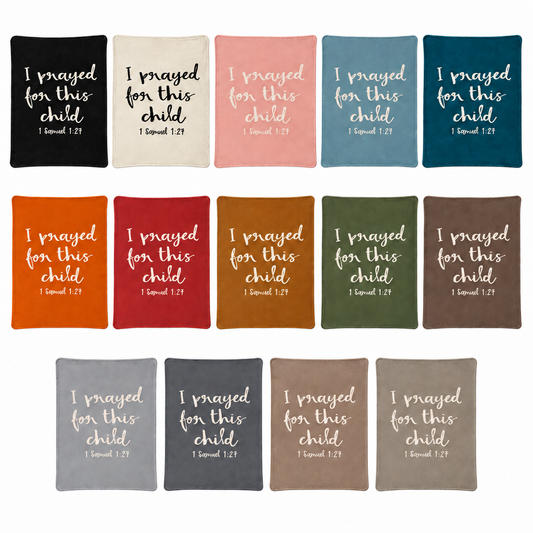 I Prayed for This Child recycled cotton blankets in all 14 colors, arranged together on white. One blanket per purchase.