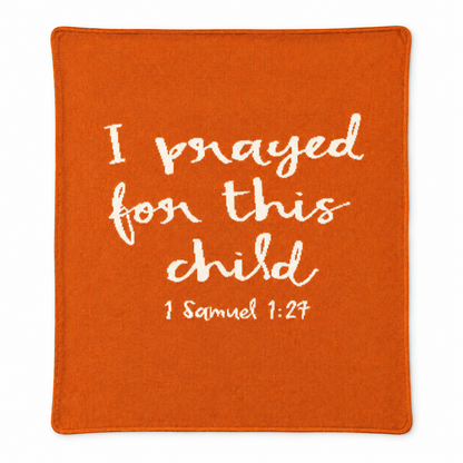I Prayed for This Child knit blanket in Braza Orange, centered full-front studio view on white.