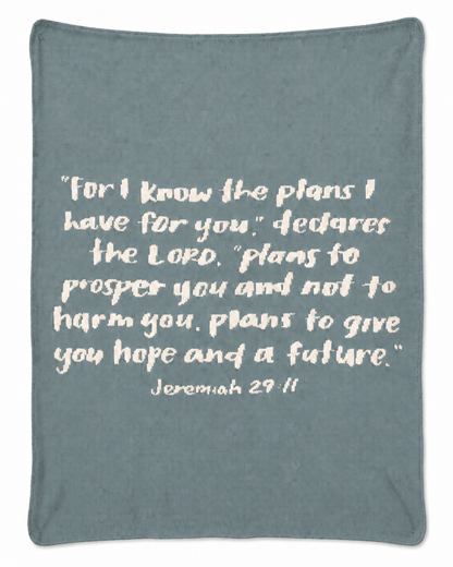 Pacific Blue Jeremiah 29:11 knit blanket in muted blue-green, full studio view.