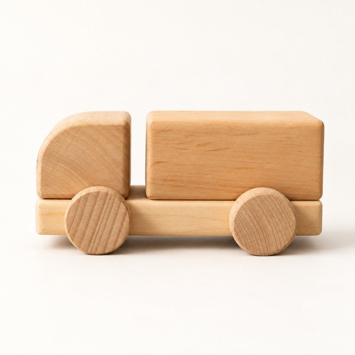 Liswood unpainted wooden cargo truck on a warm white background, side view.