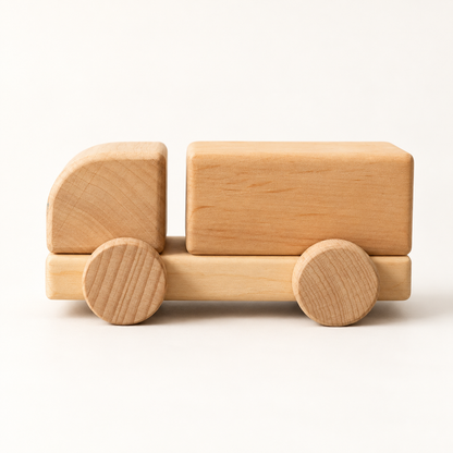 Liswood unpainted wooden cargo truck on a warm white background, side view.