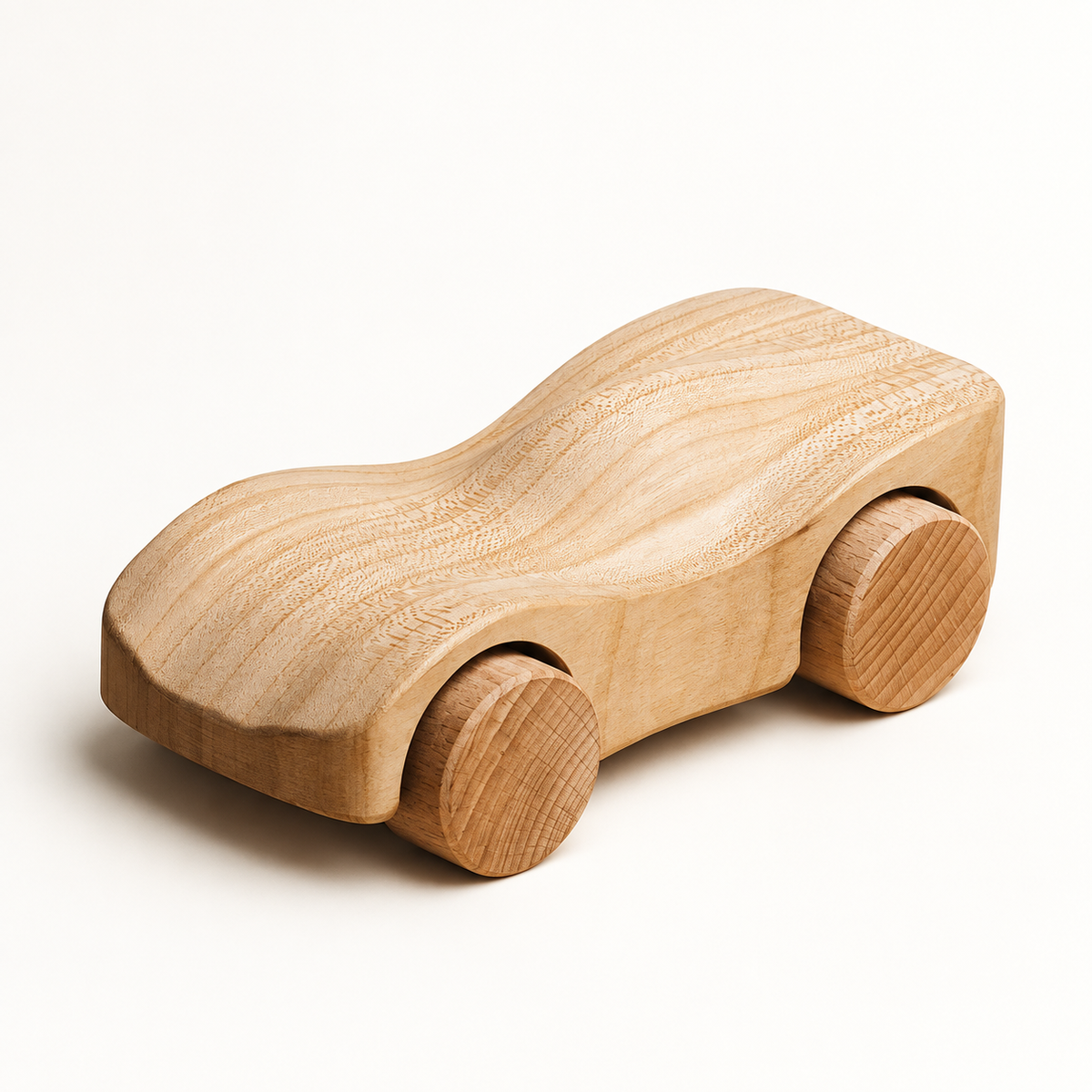 Liswood Makwin wooden toy car in natural unpainted wood, three-quarter view on warm white.