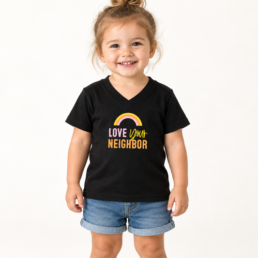 AI-styled toddler wearing the black V-neck Love Your Neighbor tee.