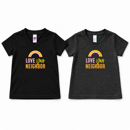 Love Your Neighbor tees: black V-neck and charcoal gray crewneck, shown at comparable display scale. Each sold separately.